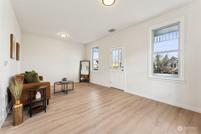 foyer entrance with light wood-type flooring