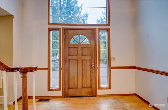 foyer entrance with light hardwood / wood-style floors