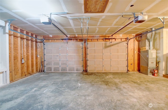 garage with heating unit and a garage door opener