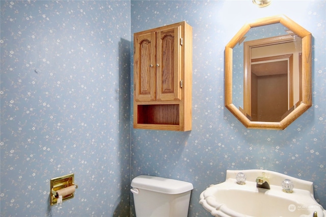 bathroom with toilet and sink