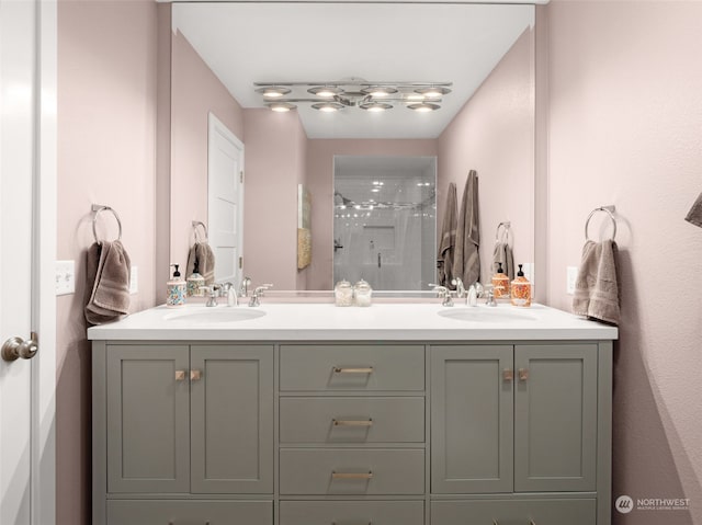 bathroom with vanity and a shower with shower door