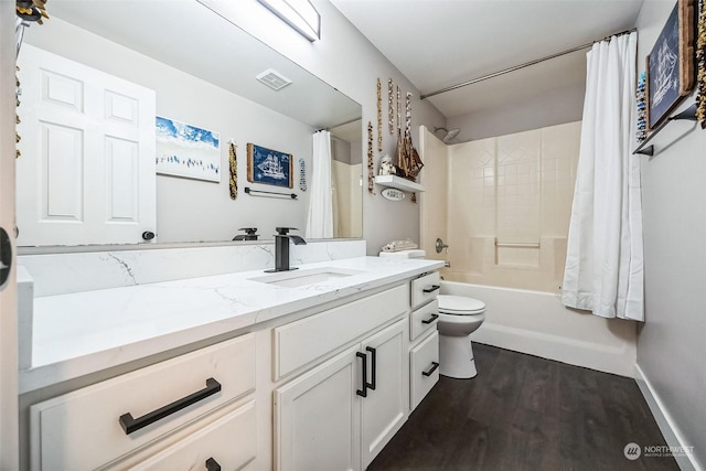 full bathroom with hardwood / wood-style flooring, shower / tub combo with curtain, vanity, and toilet