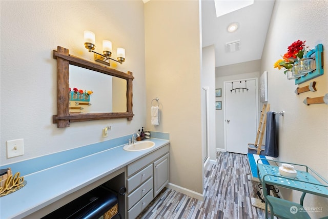 bathroom featuring vanity and wood-type flooring