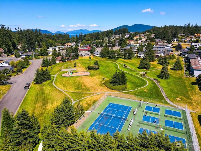 birds eye view of property with a mountain view