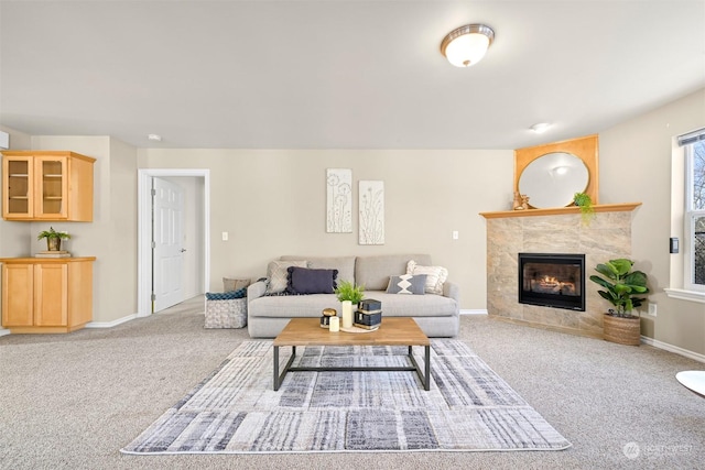 carpeted living room with a fireplace