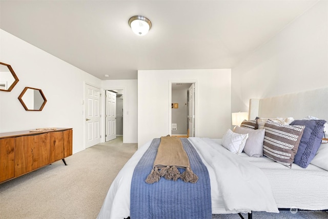 bedroom with light colored carpet