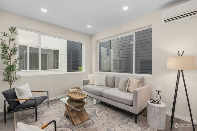 living room with hardwood / wood-style flooring and a wall unit AC