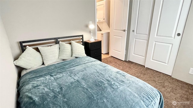 545 Hendricks St Unit 21A, Port Townsend, WA 98368 - carpeted bedroom with stacked washing maching and dryer