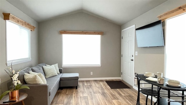 545 Hendricks St Unit 21A, Port Townsend, WA 98368 - sitting room featuring vaulted ceiling and light hardwood / wood-style flooring