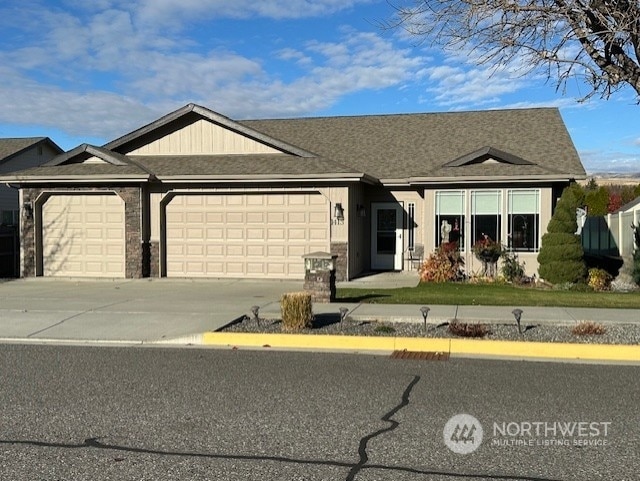 ranch-style house featuring a garage