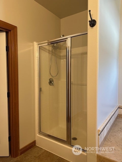 bathroom featuring an enclosed shower