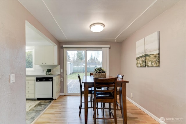 dining area featuring light wood-type flooring