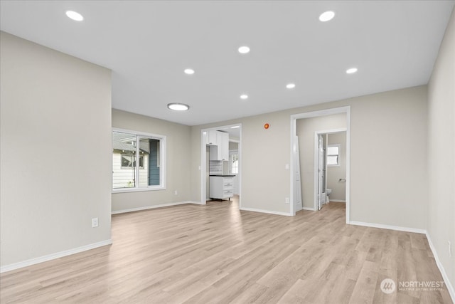 unfurnished living room with light hardwood / wood-style flooring