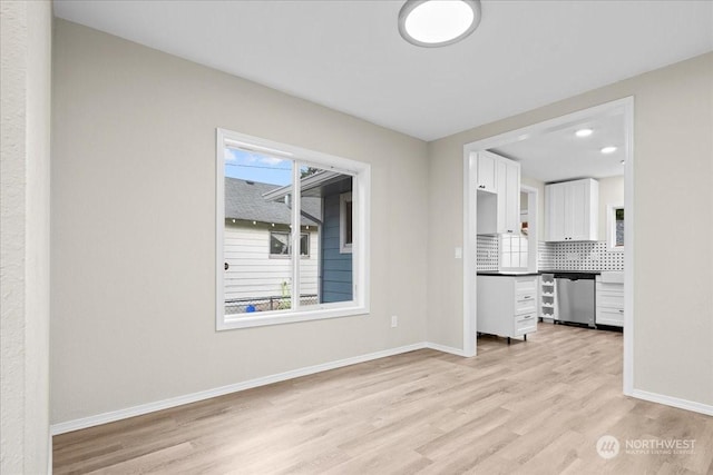 unfurnished living room with light hardwood / wood-style flooring