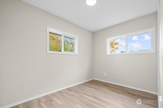 spare room with light wood-type flooring