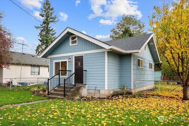 bungalow-style house with a front yard