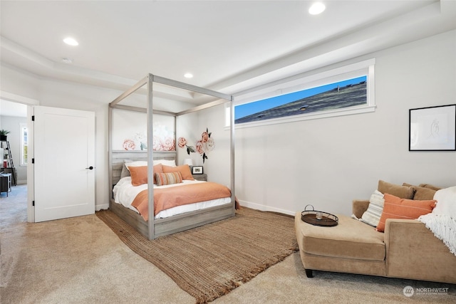 bedroom featuring light carpet