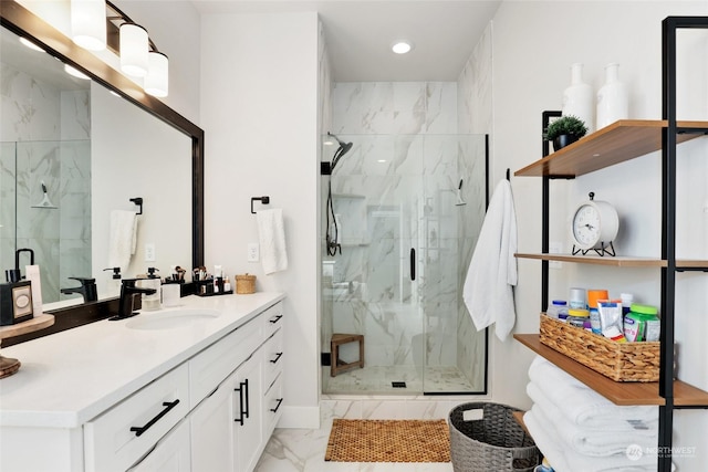 bathroom with vanity and a shower with shower door