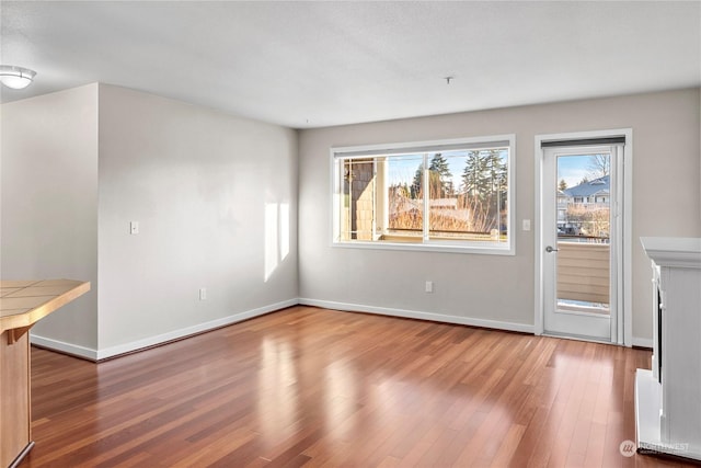 unfurnished living room with hardwood / wood-style floors