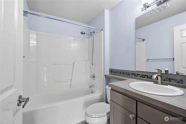 full bathroom with tasteful backsplash, vanity, toilet, and shower / washtub combination