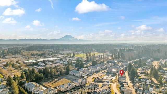 birds eye view of property with a mountain view