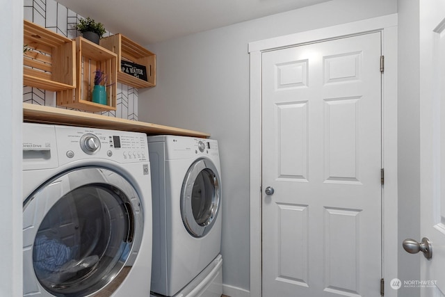 washroom featuring washing machine and clothes dryer