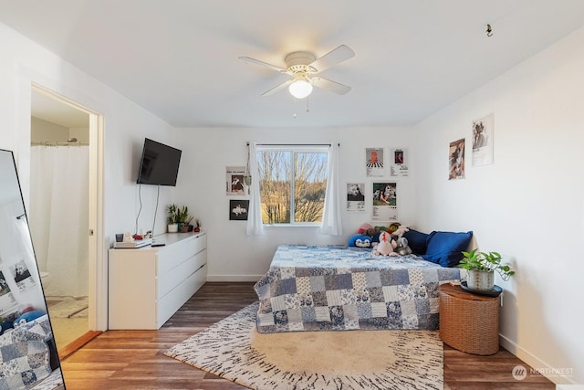 bedroom with hardwood / wood-style flooring and ceiling fan