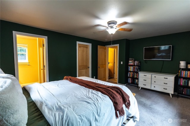 carpeted bedroom with ensuite bathroom and ceiling fan