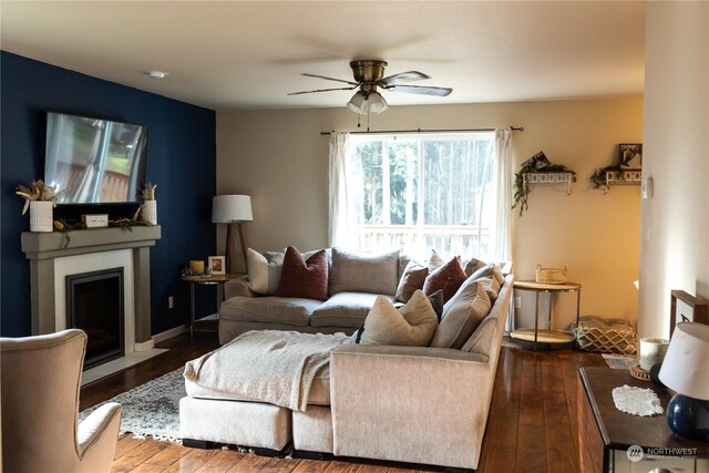 living room with hardwood / wood-style floors and ceiling fan