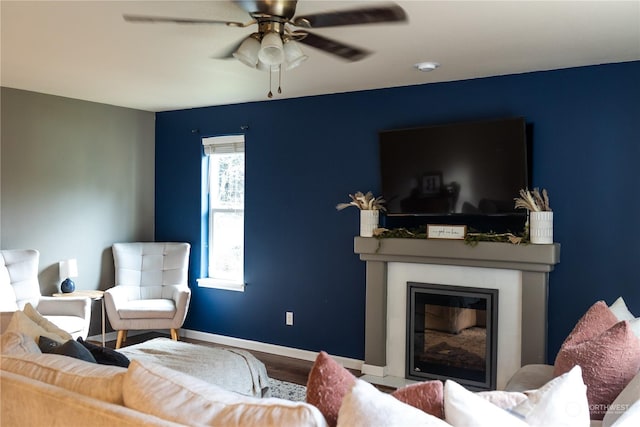 living room with hardwood / wood-style floors and ceiling fan