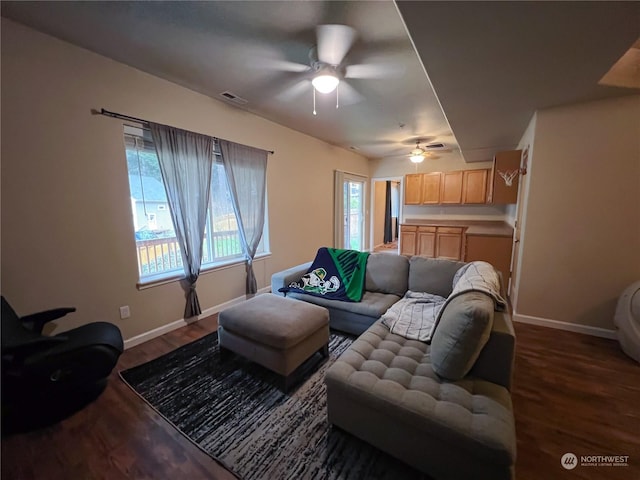 living room featuring dark hardwood / wood-style floors and ceiling fan