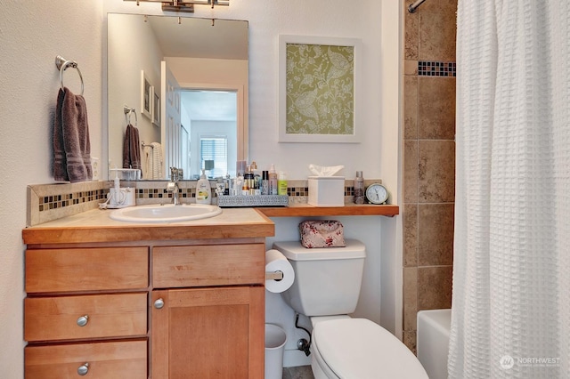 full bathroom with tasteful backsplash, toilet, vanity, and shower / bath combo with shower curtain