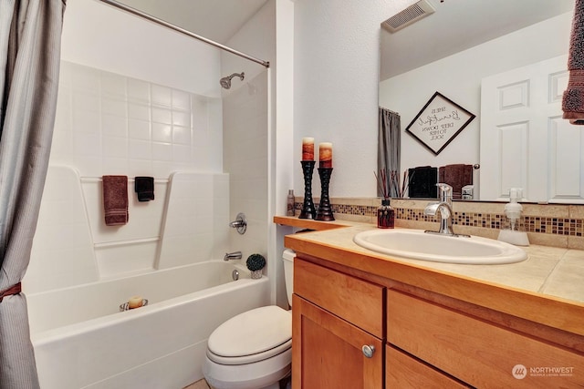 full bathroom featuring tasteful backsplash, vanity, toilet, and shower / bathtub combination with curtain