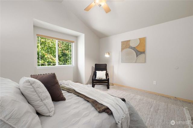 bedroom with ceiling fan, carpet floors, and vaulted ceiling