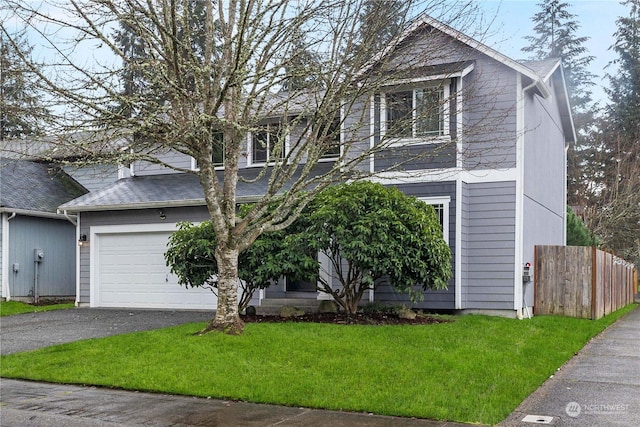 view of front facade featuring a garage and a front lawn