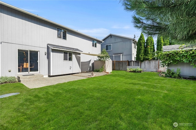 view of yard with a patio area and a storage shed