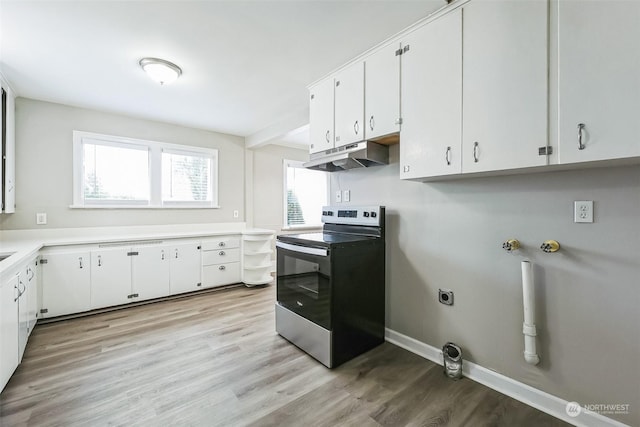 laundry room with light hardwood / wood-style floors