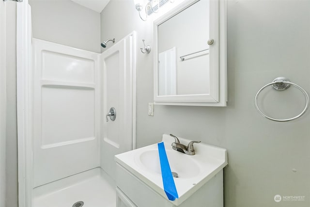 bathroom featuring vanity and walk in shower