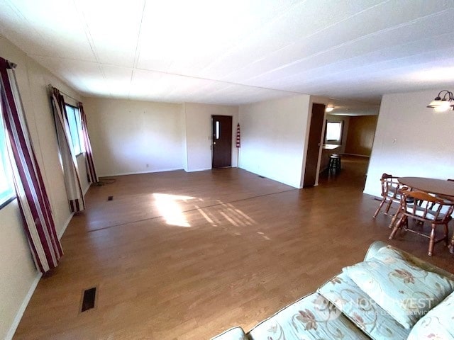 living room with dark hardwood / wood-style flooring