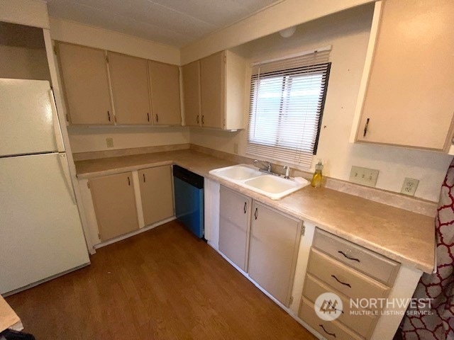 kitchen featuring sink, hardwood / wood-style flooring, dishwasher, and white refrigerator