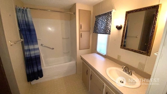 bathroom featuring vanity and shower / bath combination with curtain