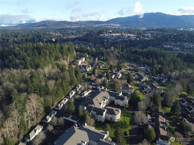 bird's eye view with a residential view, a mountain view, and a forest view