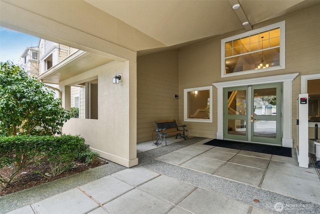 doorway to property with stucco siding and a patio area