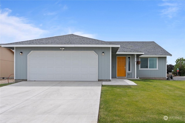 ranch-style home with a garage and a front yard