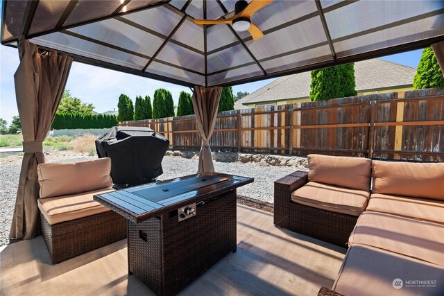 view of patio / terrace with an outdoor hangout area, a gazebo, grilling area, and ceiling fan