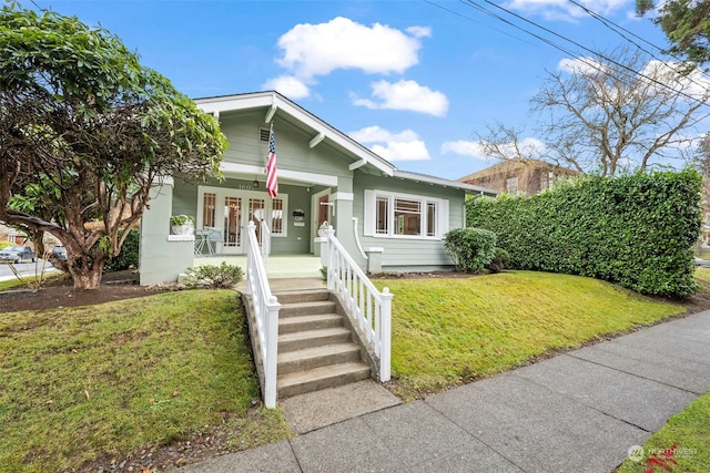 view of front facade featuring a front yard and a porch