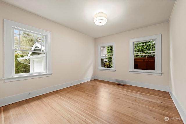 unfurnished room featuring light wood-type flooring