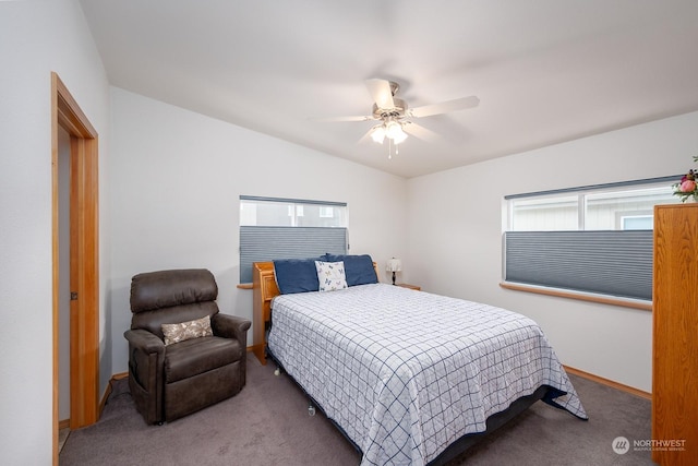 bedroom featuring vaulted ceiling, ceiling fan, and carpet flooring