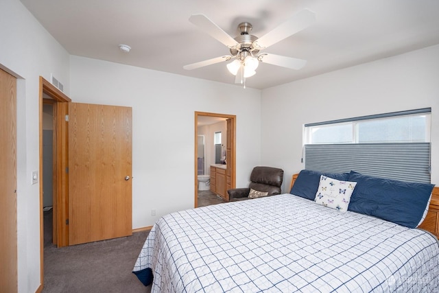 carpeted bedroom featuring ensuite bath and ceiling fan