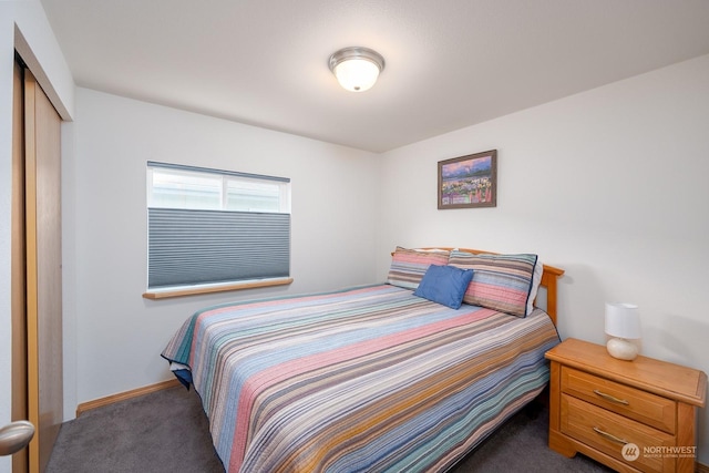 carpeted bedroom featuring a closet